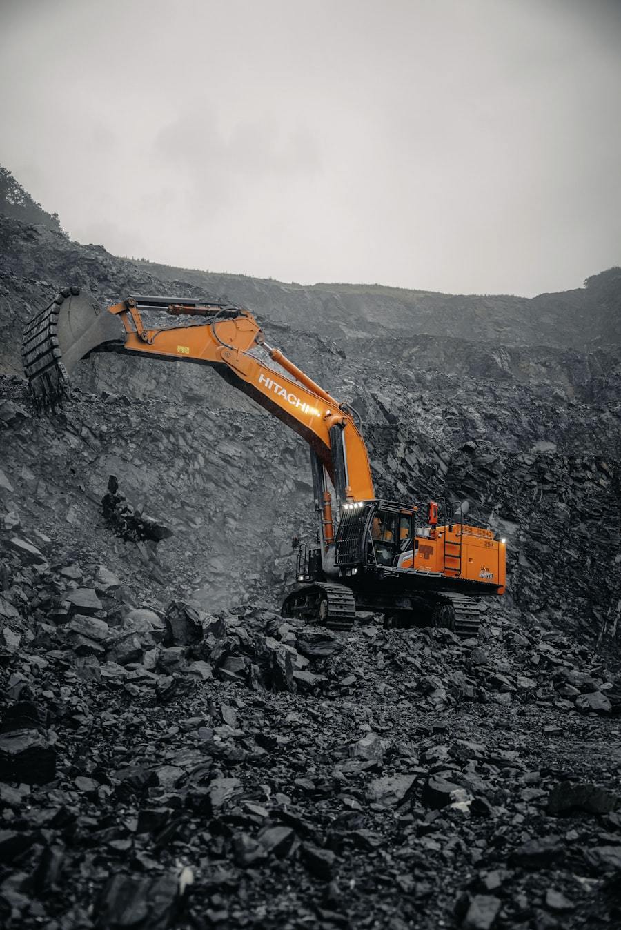 Excavator bucket lined with wear-resistant steel plate in a mine