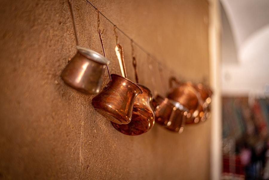 Copper-clad triwall pans searing food in a kitchen, demonstrating fast even heat distribution