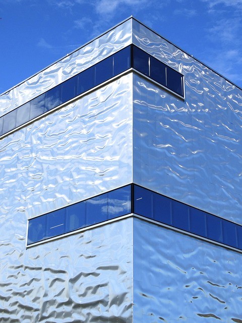 PVDF coated aluminium panels installed as a metallic building cladding facade