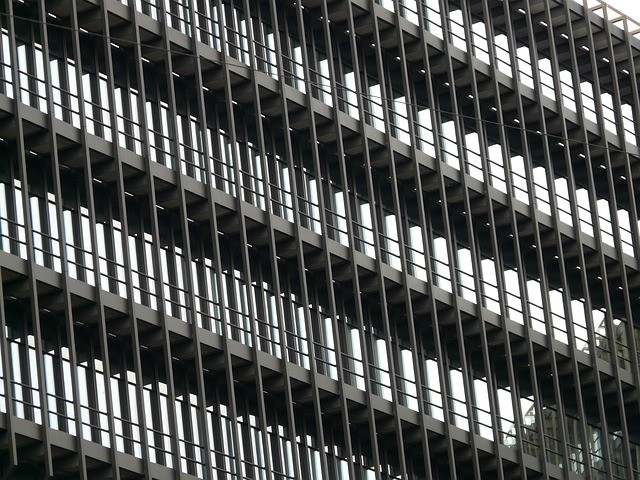 Pre-painted metal panel facade system on a modern building elevation