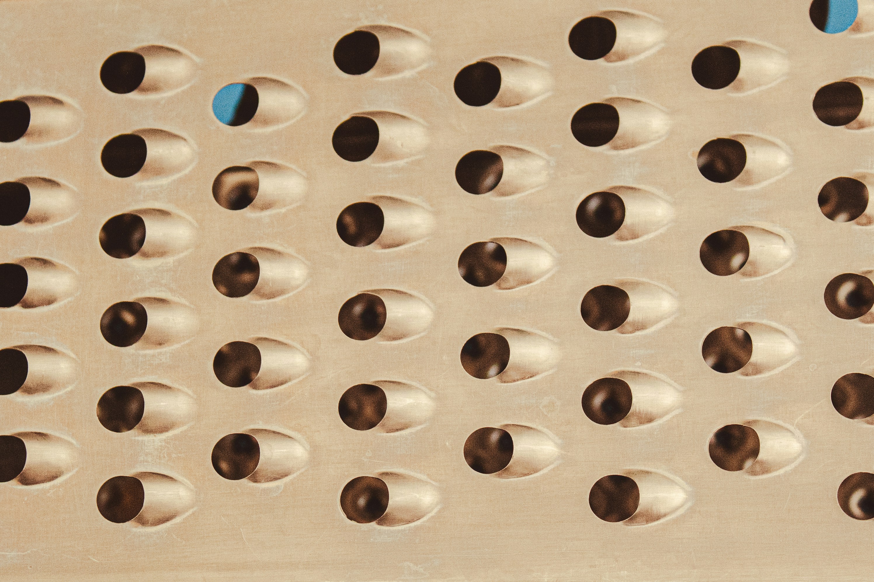 A simplified sheet metal enclosure design with long slots for ventilation instead of many small holes.