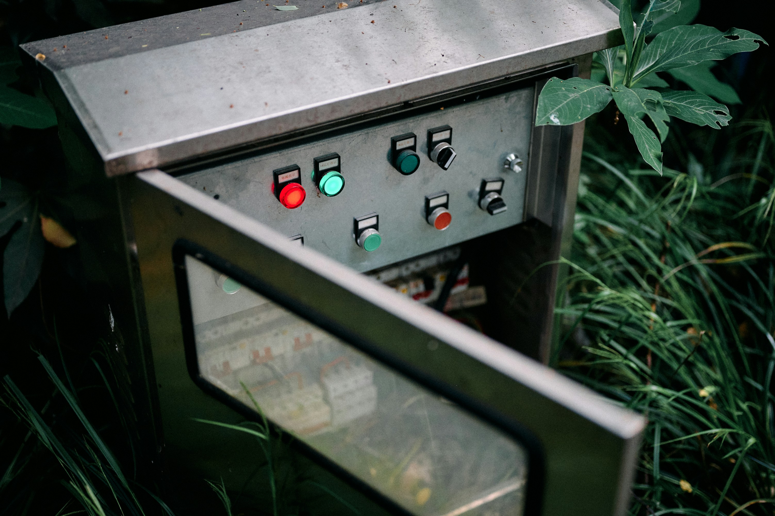 A sturdy, locked outdoor equipment enclosure protecting sensitive electronics from rain.