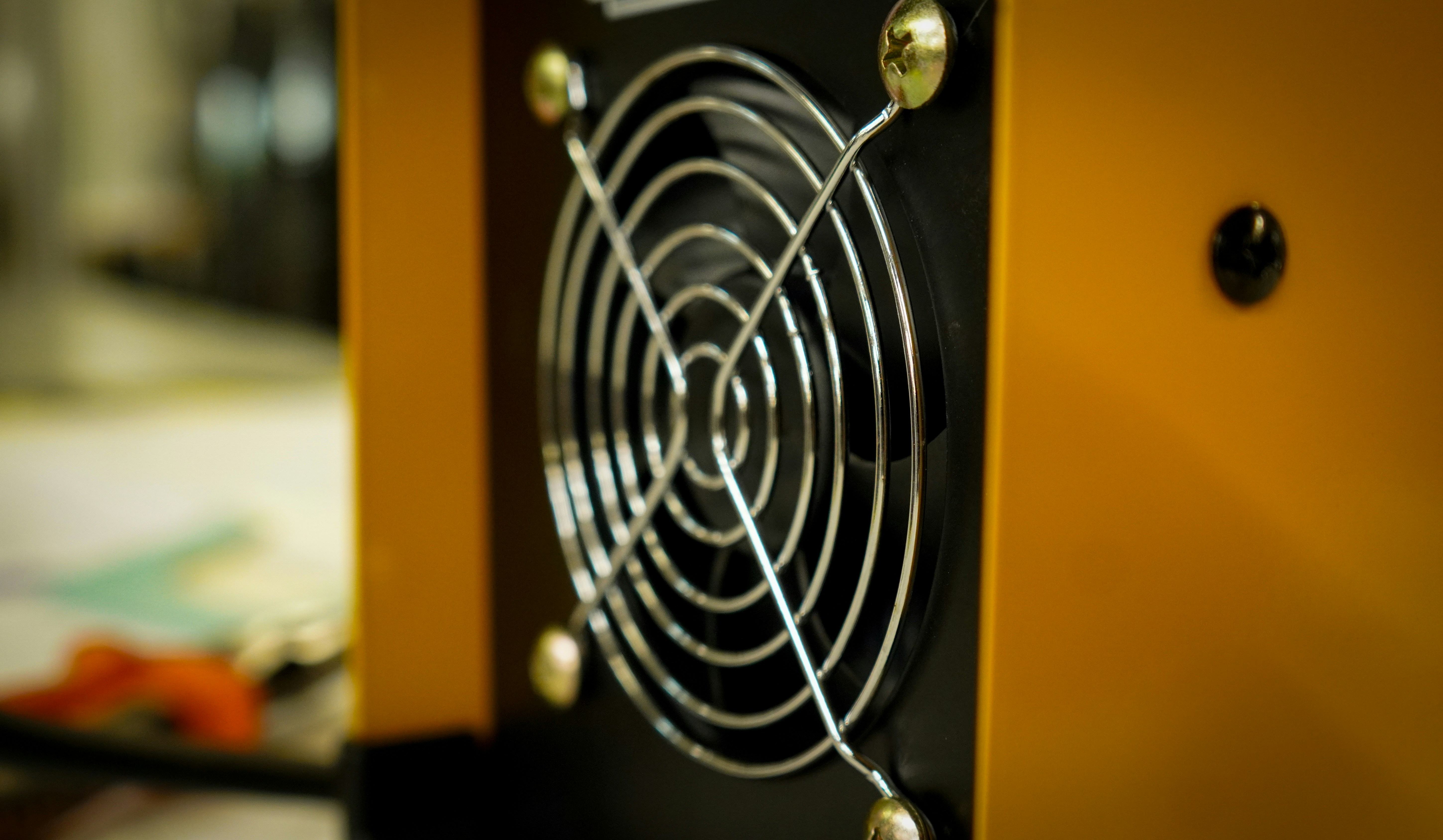 An industrial metal cabinet with integrated fans and ventilation for thermal management