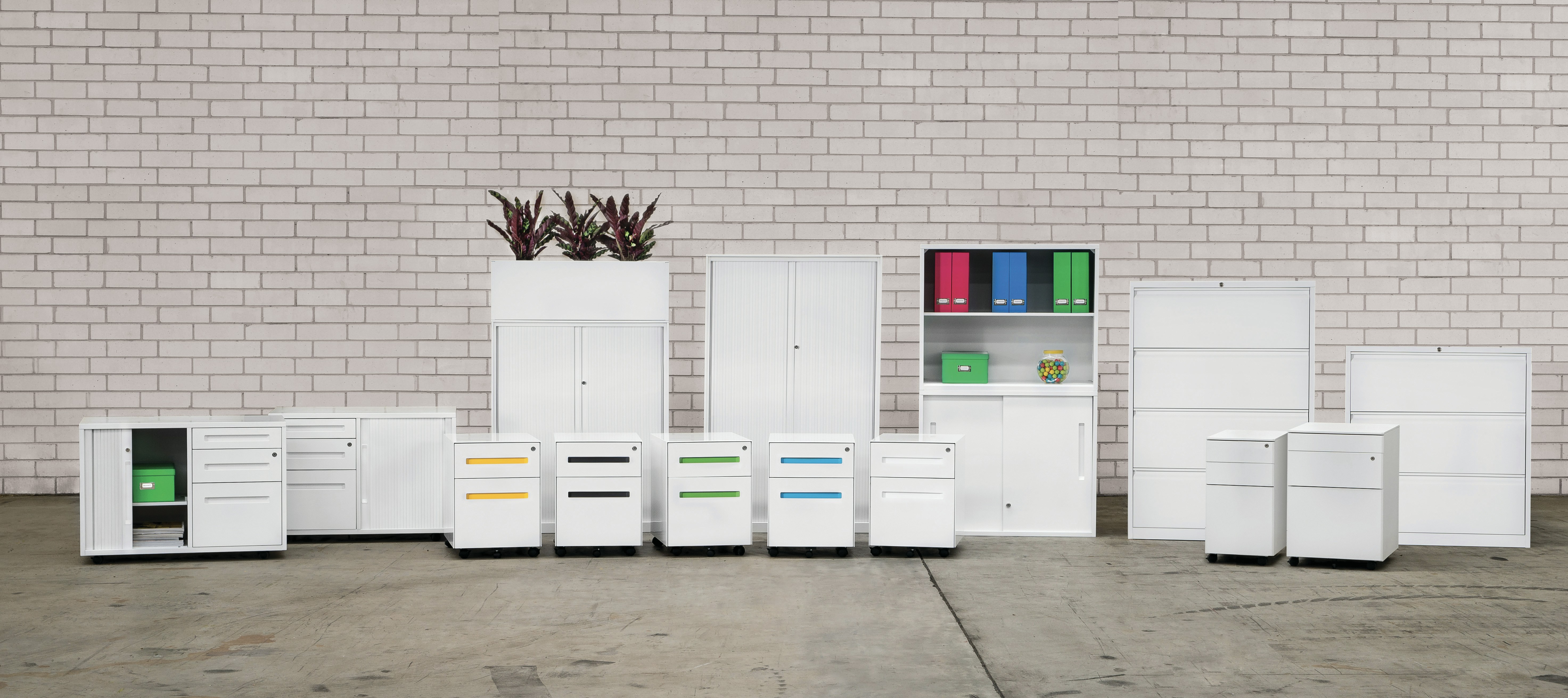 A collection of custom metal cabinets of different sizes and finishes for various industrial applications