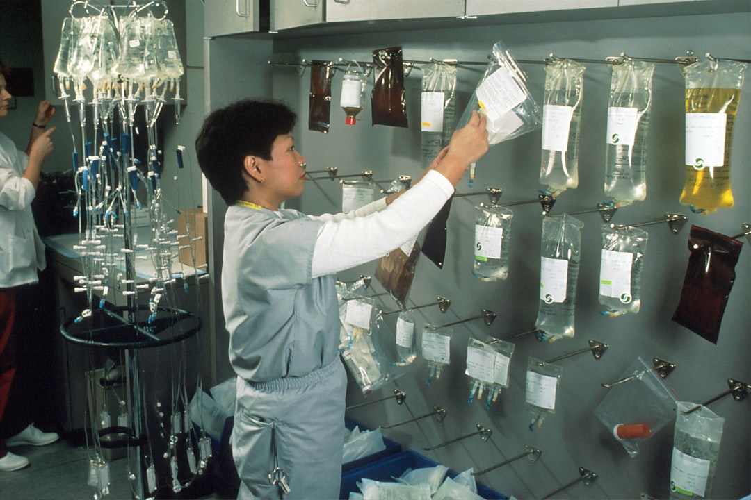 A lab technician carefully handling GHK-Cu freeze-dried powder