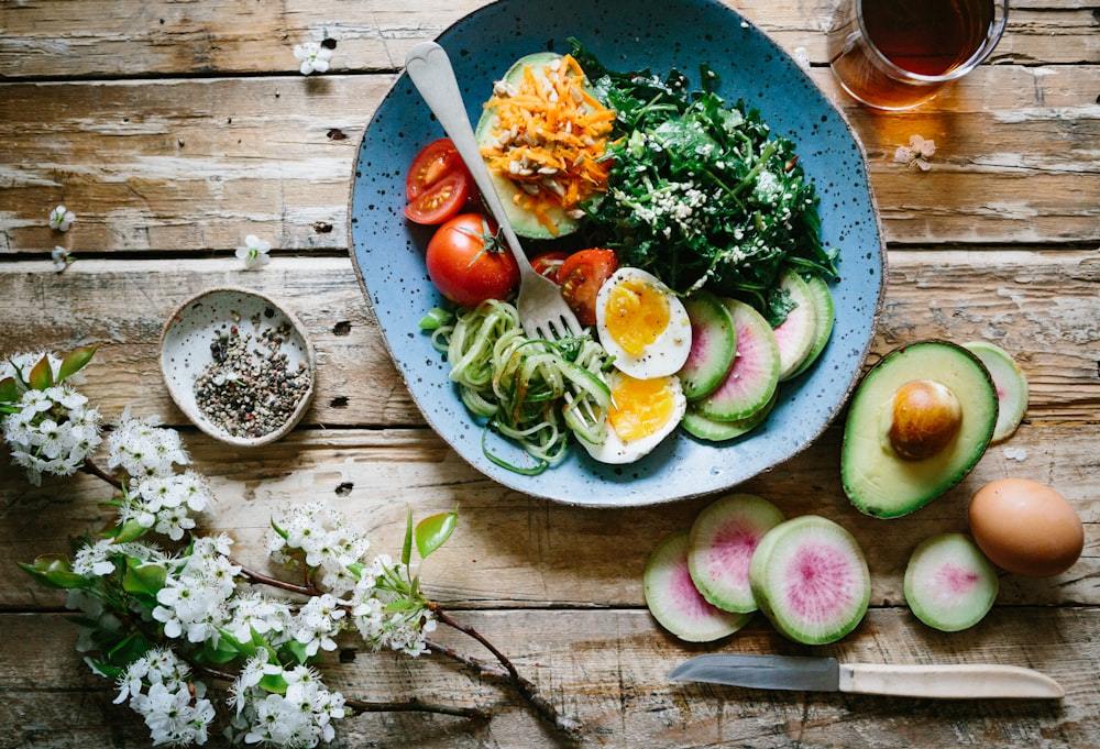 A vibrant bowl of fresh vegetables and whole foods, representing brain-nourishing everyday nutrition