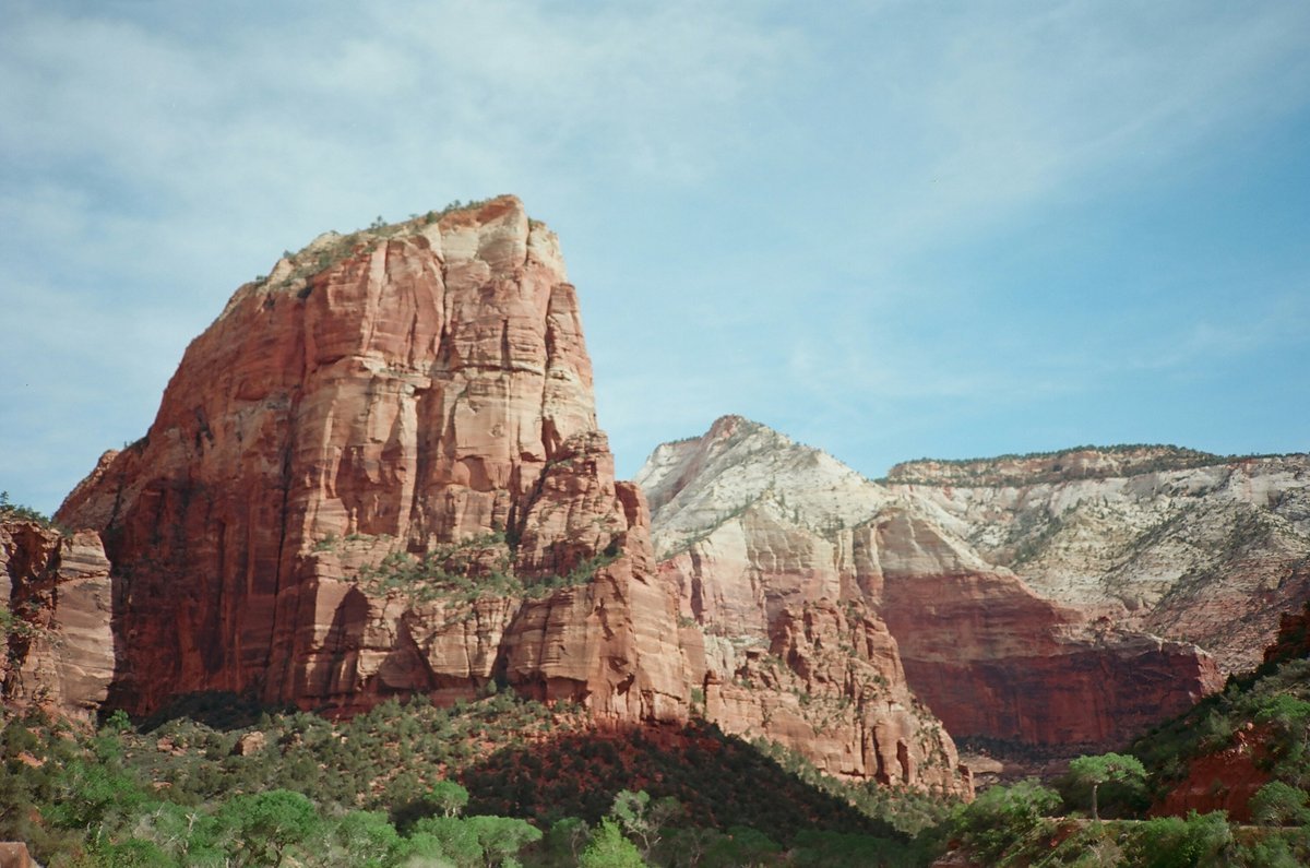 Hiker enjoying majestic mountain views with vitality and fresh air