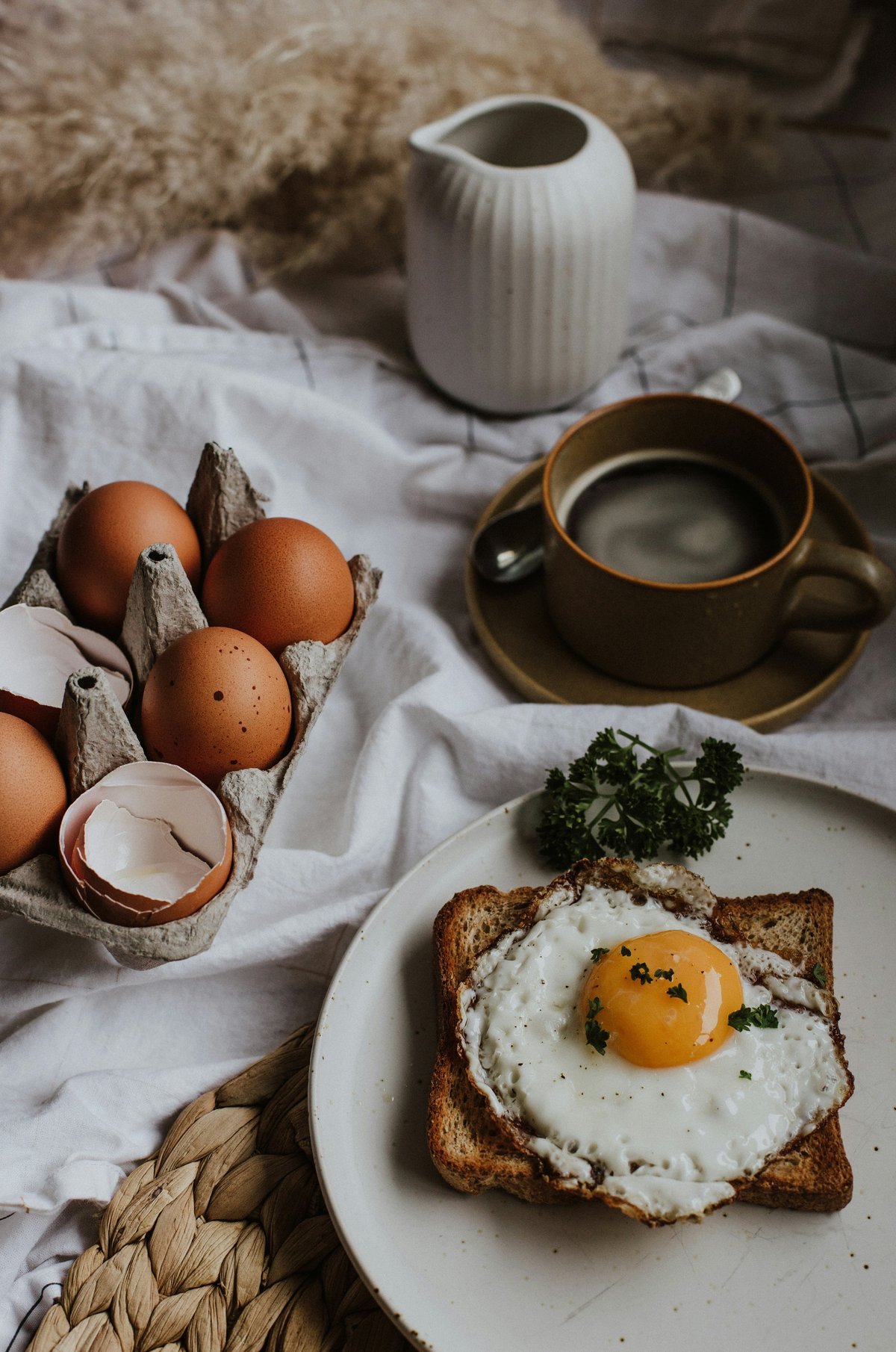 Cozy morning breakfast scene with eggs on toast and coffee mug
