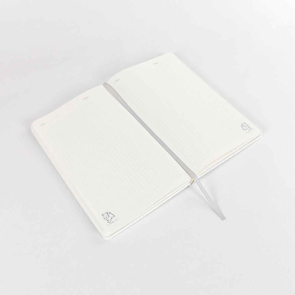 Spotted Puppy A5 MINI hardcover notebook laying flat, showing comfortable 180-degree opening for easy writing.