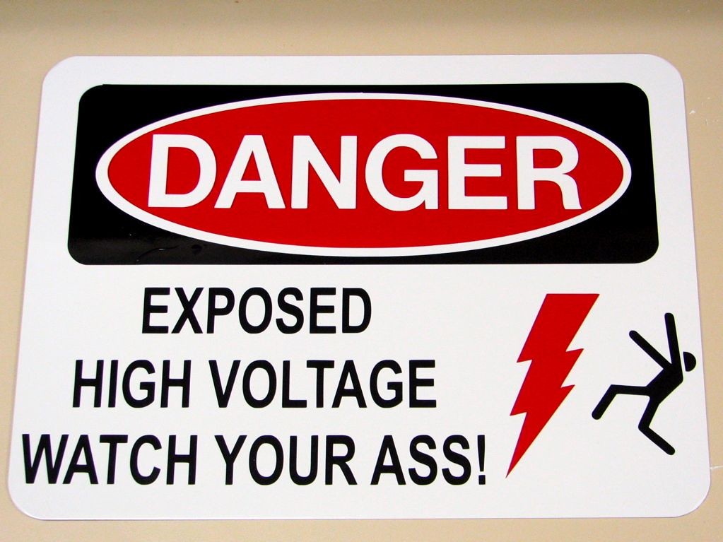 A red warning sign symbolizing safety and compliance alert