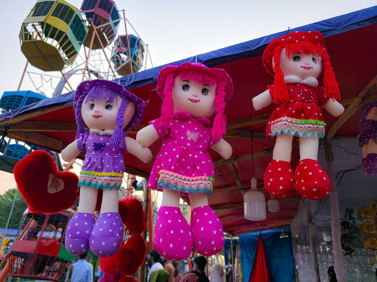 Colorful dolls at a lively outdoor market