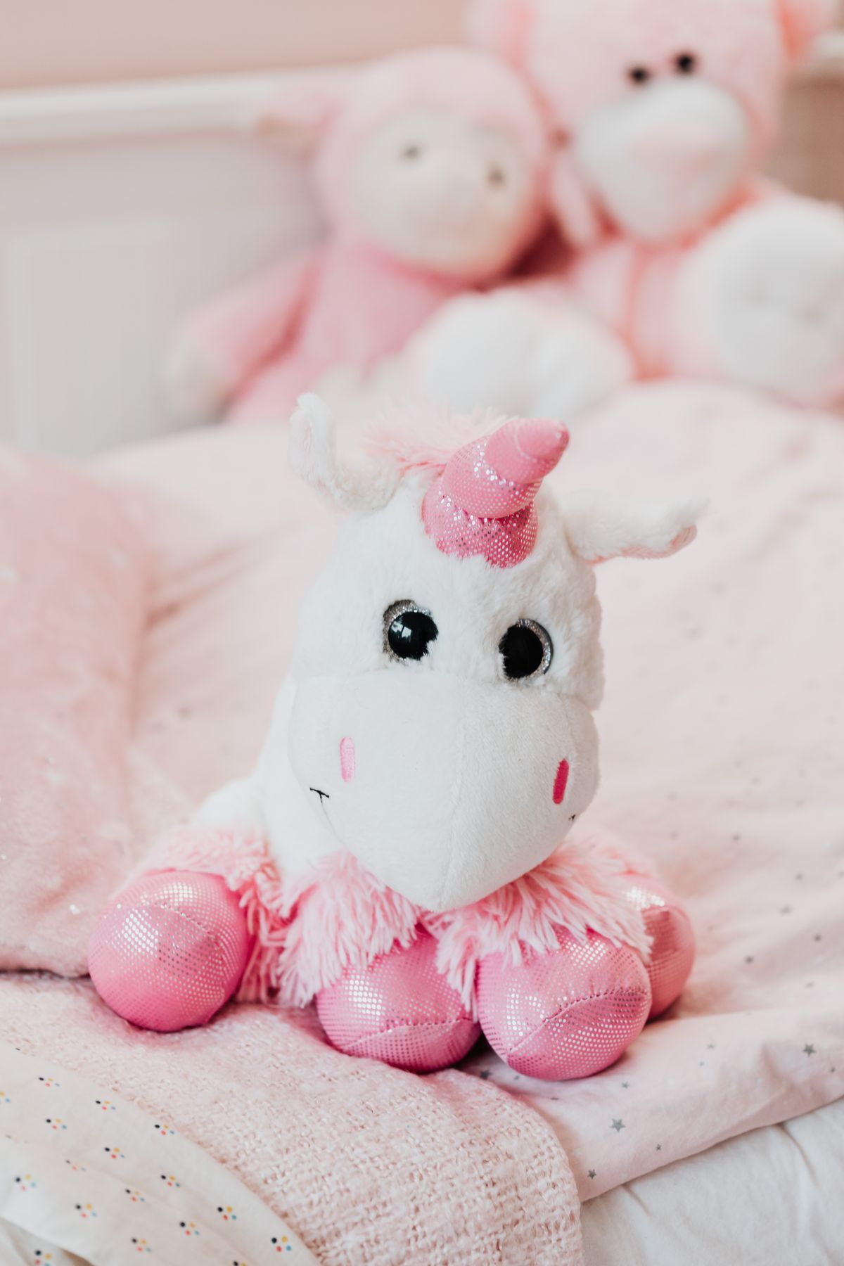 White and pink unicorn plush toy