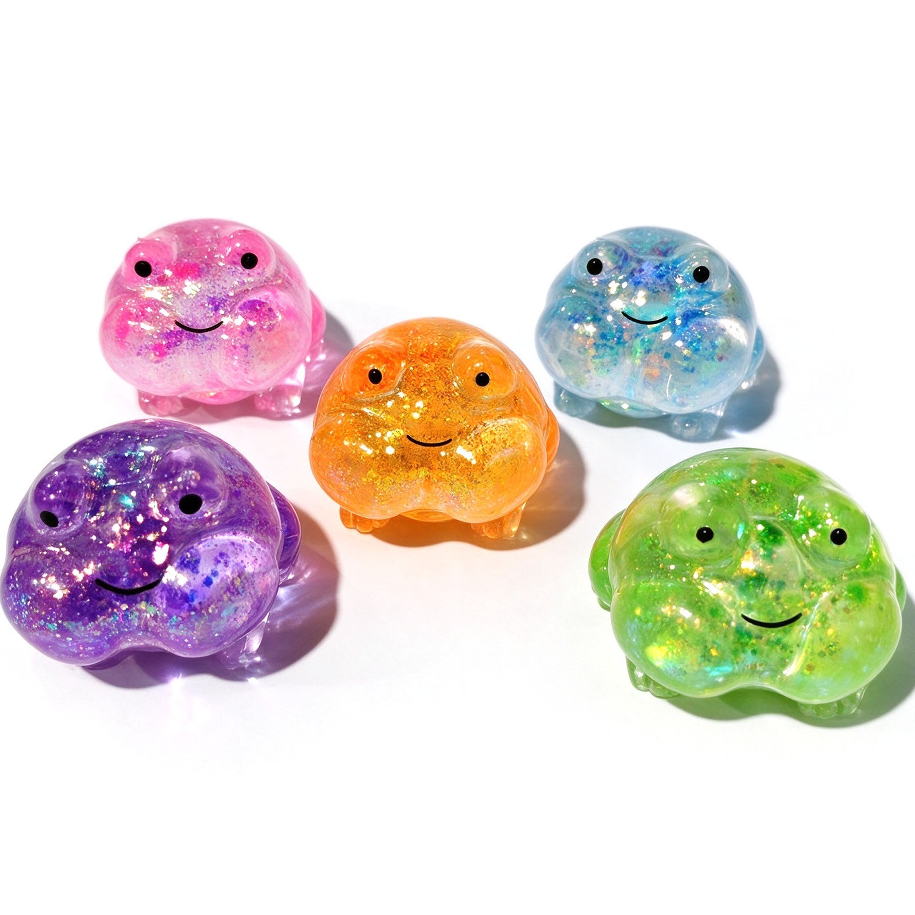 Close-up of the glitter filling inside the frog squishy
