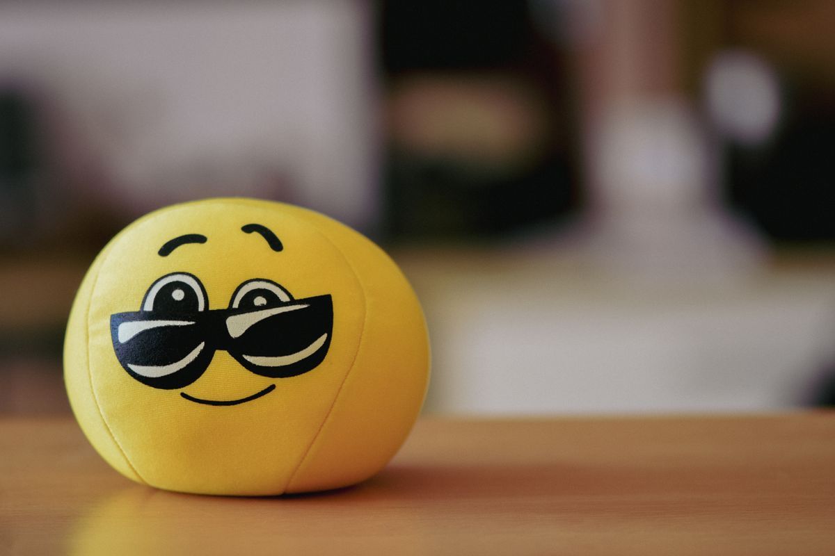 Yellow smiley-face stress ball representing the booming category