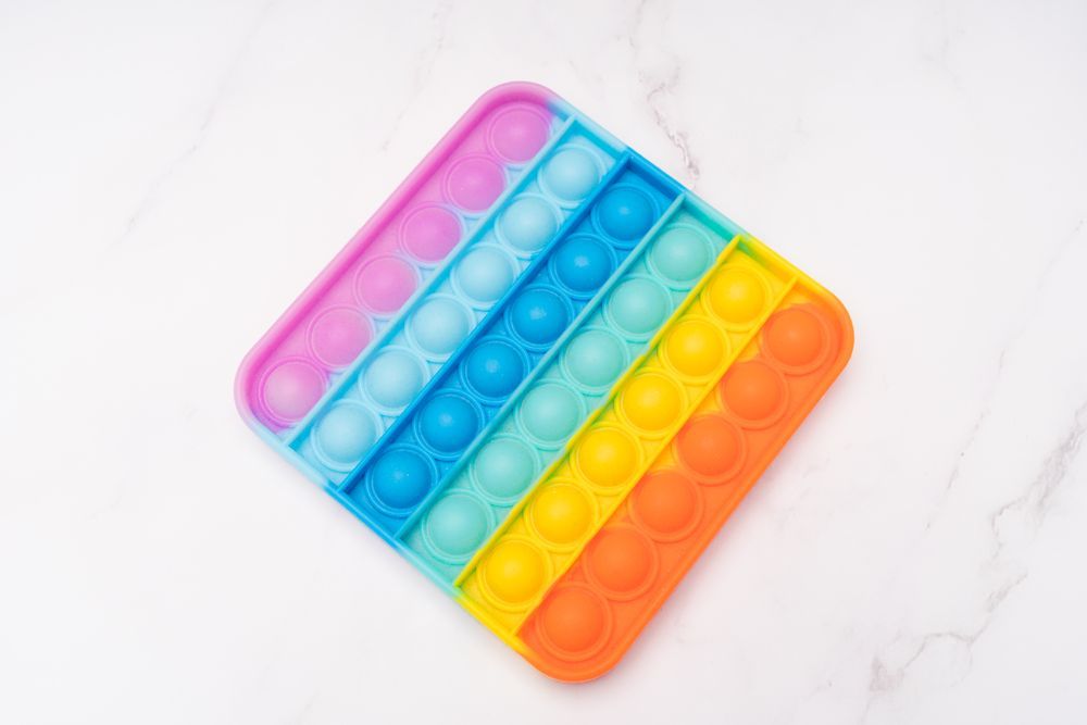 Marbled squishy cubes photographed on a white background