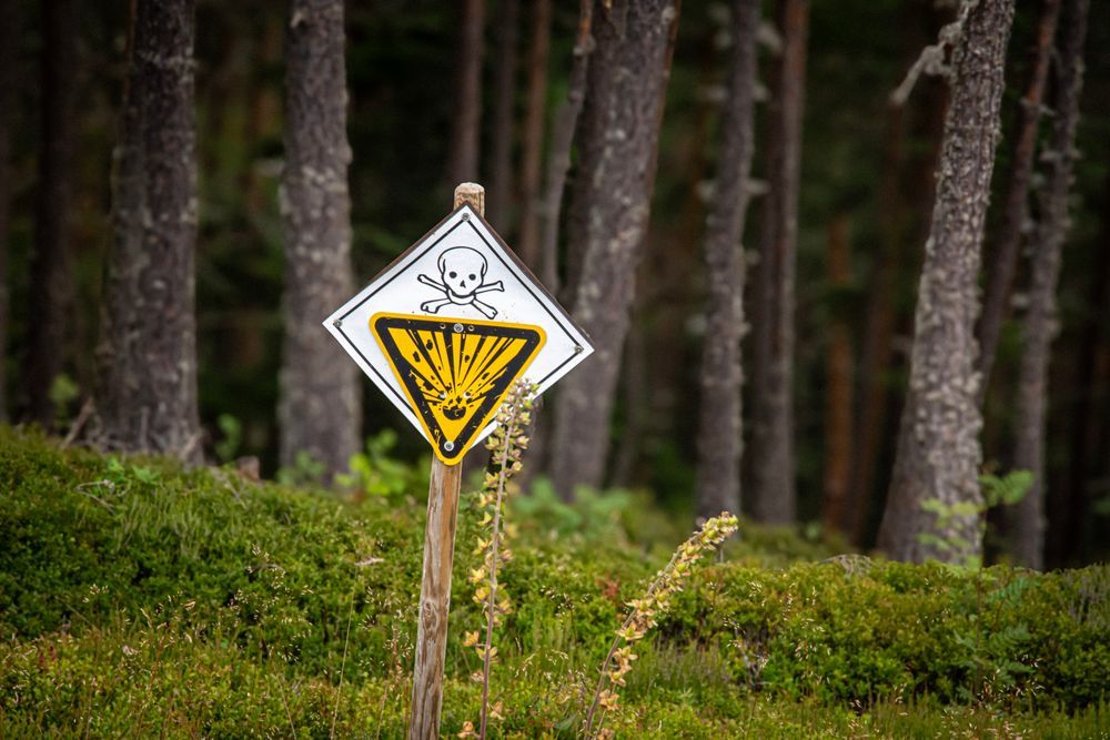 A poison hazard warning sign with a skull and crossbones