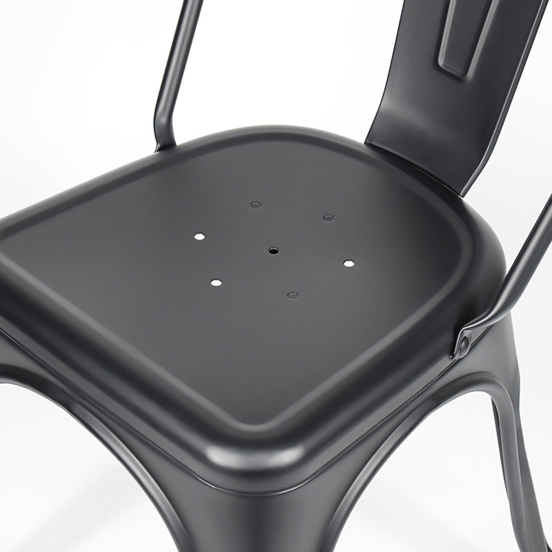 Powder-coated metal chair seat close-up