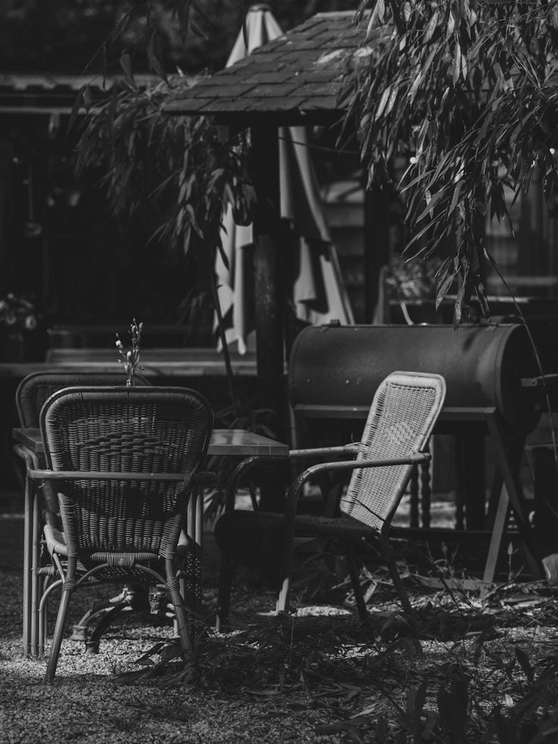 Outdoor patio restaurant setting with umbrella and furniture