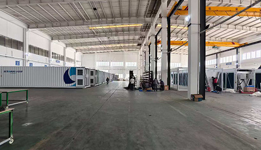 Containerized cooling units stored inside the CoolSpace factory hall