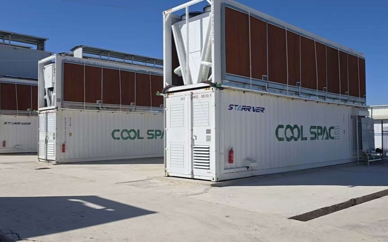 CoolSpace containers with rooftop dry coolers operating outdoors on an open site