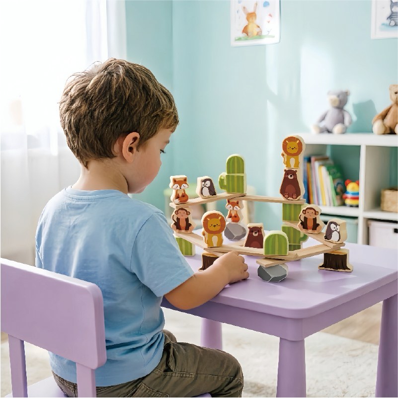 Child playing with forest animal wooden balance stacking blocks