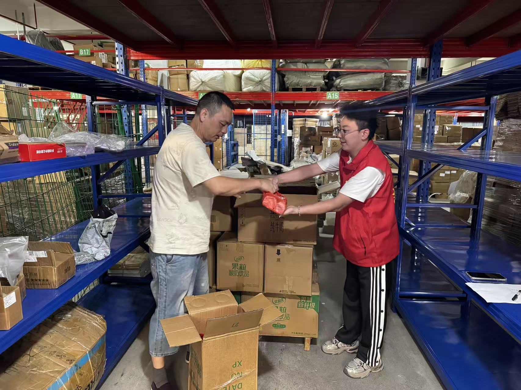 Employee opening a Mid-Autumn mooncake gift box at KIDMERRY custom wooden toy manufacturer