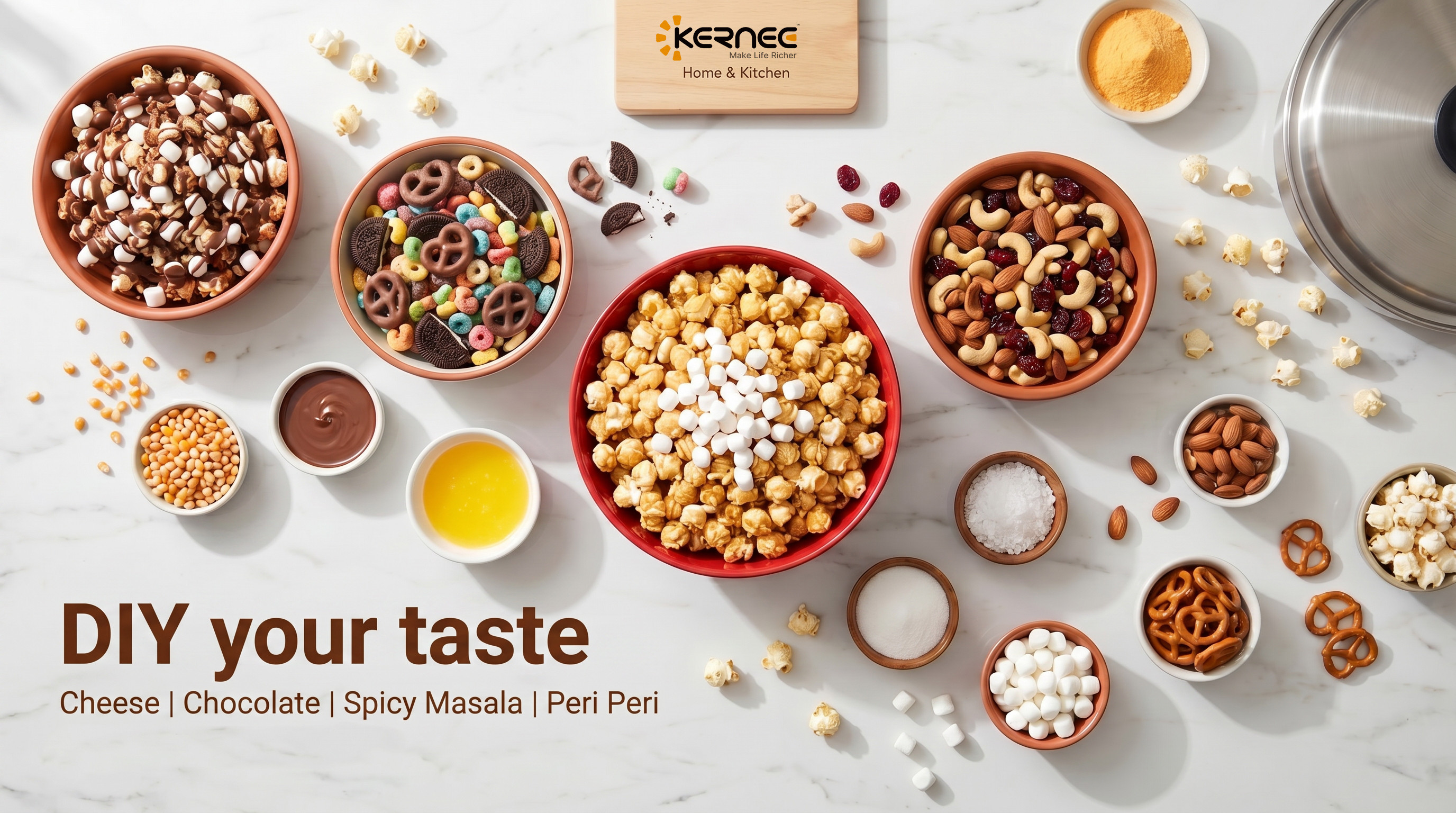 Kernec Home & Kitchen popcorn DIY station featuring various sweet and savory toppings like chocolate, cheese, nuts, and marshmallows on a marble background.