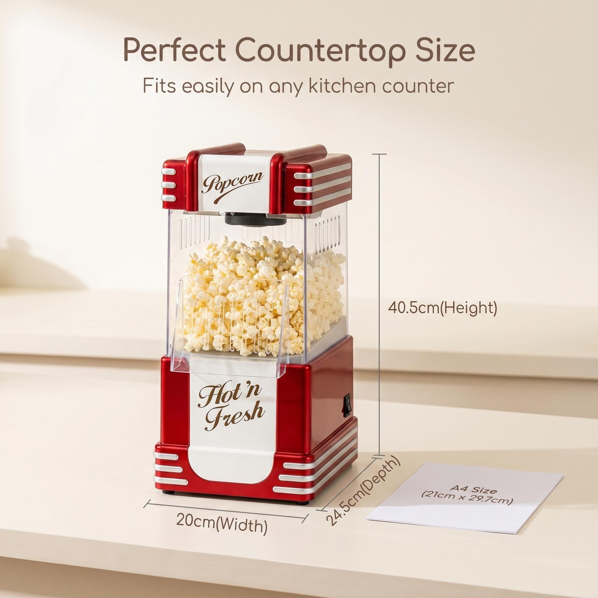 Infographic showing the compact dimensions of the red popcorn maker: 34.5cm width, 22.5cm height, and 29cm depth. An A4 paper reference (21cm x 29.7cm) is placed alongside to show its relative size. Text: 'Compact Size Fits Any Corner.