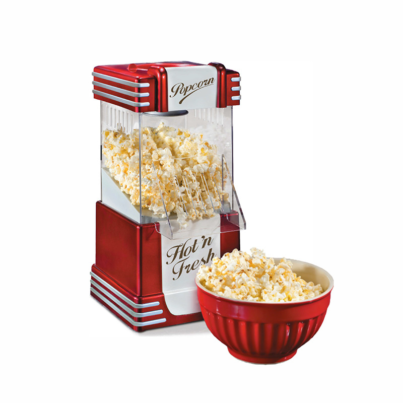 Product shot of a Kernee retro-style popcorn maker: featuring a classic red and silver body with a transparent viewing chamber, shown with freshly popped popcorn and a bowl ready to serve.