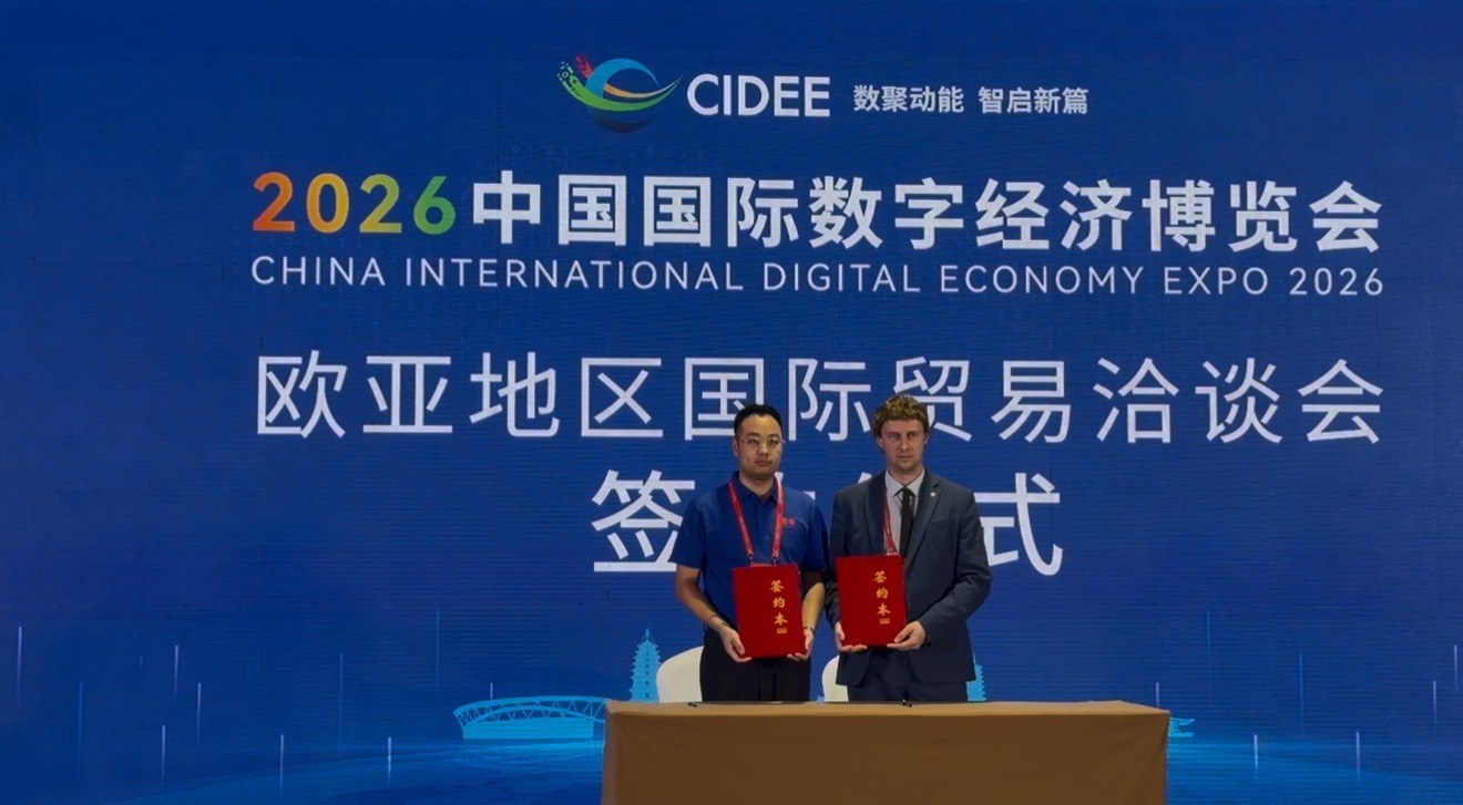 Both parties holding the signed agreement at the CIDEE 2026 signing ceremony