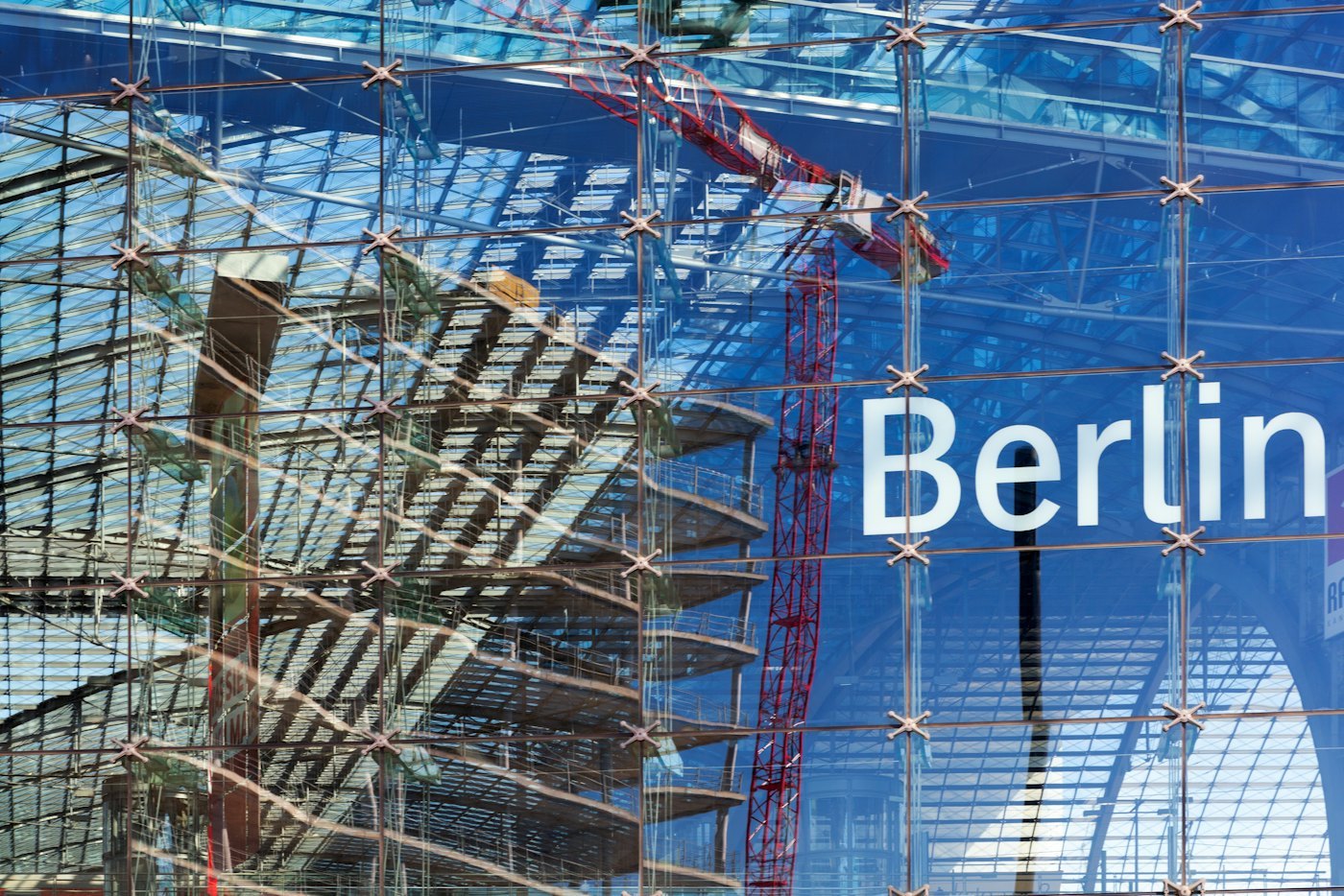 Glass curtain wall construction showing facade interfaces, structural conditions, and site coordination