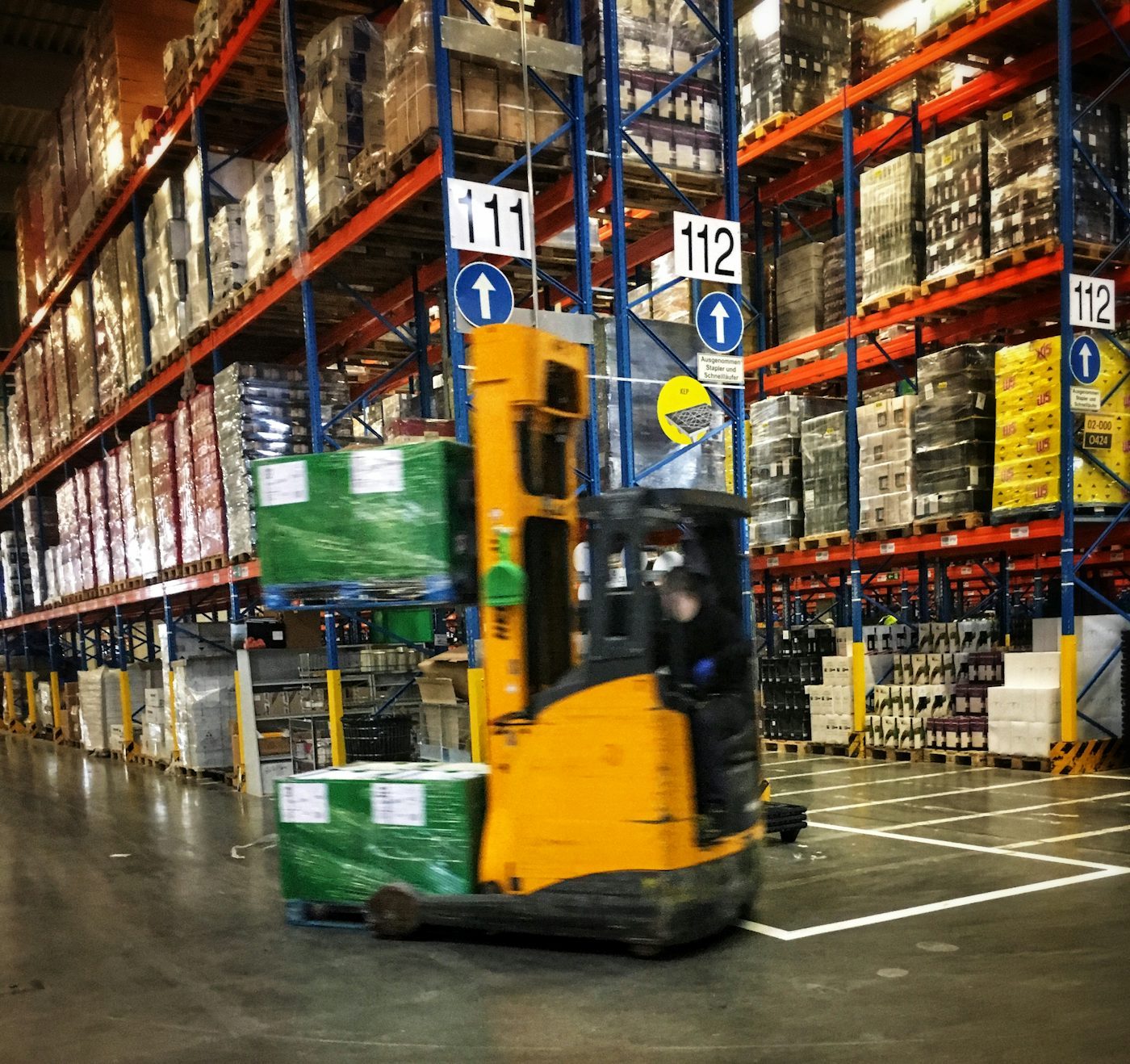 Warehouse handling scene illustrating packaging, labeling, storage, and logistics questions for complex curtain wall panels