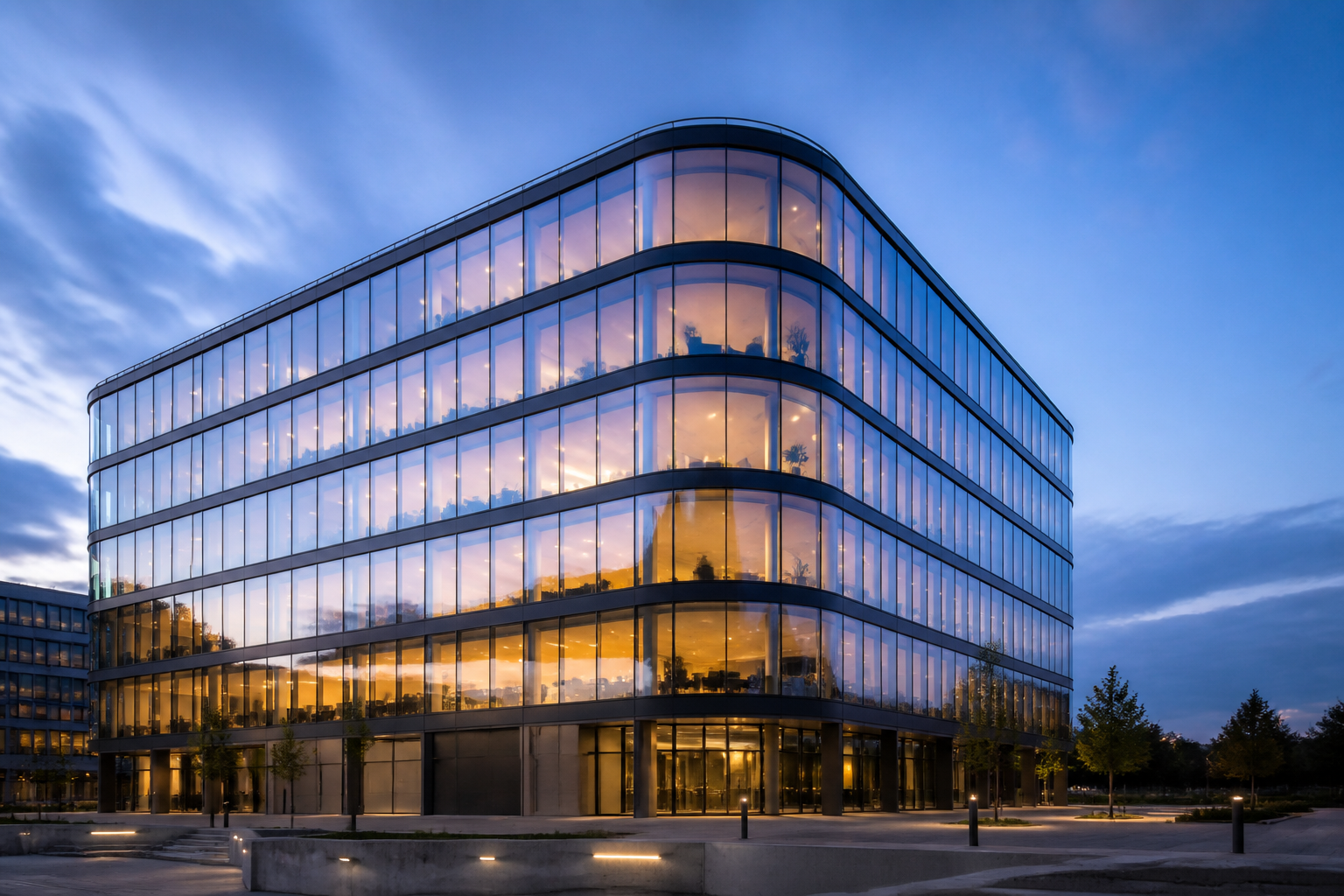 Premium European commercial building with refined curtain wall facade at twilight
