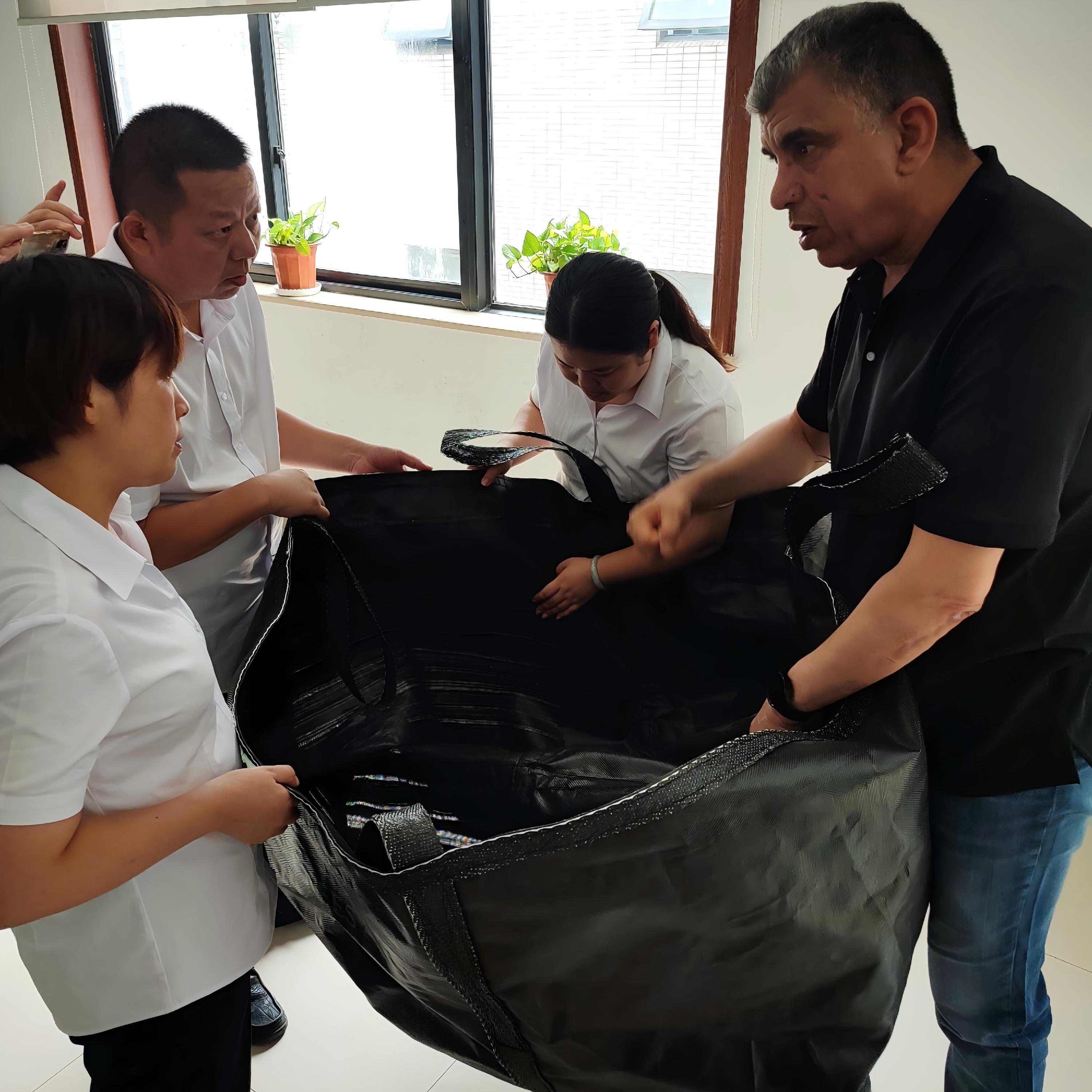 Saudi Arabian clients visit HOKBG factory to know Anti-UV grow bags for trees planting
