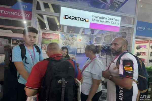 DarkTone team discussing laser system specifications with a visitor at the Prolight + Sound Bangkok booth