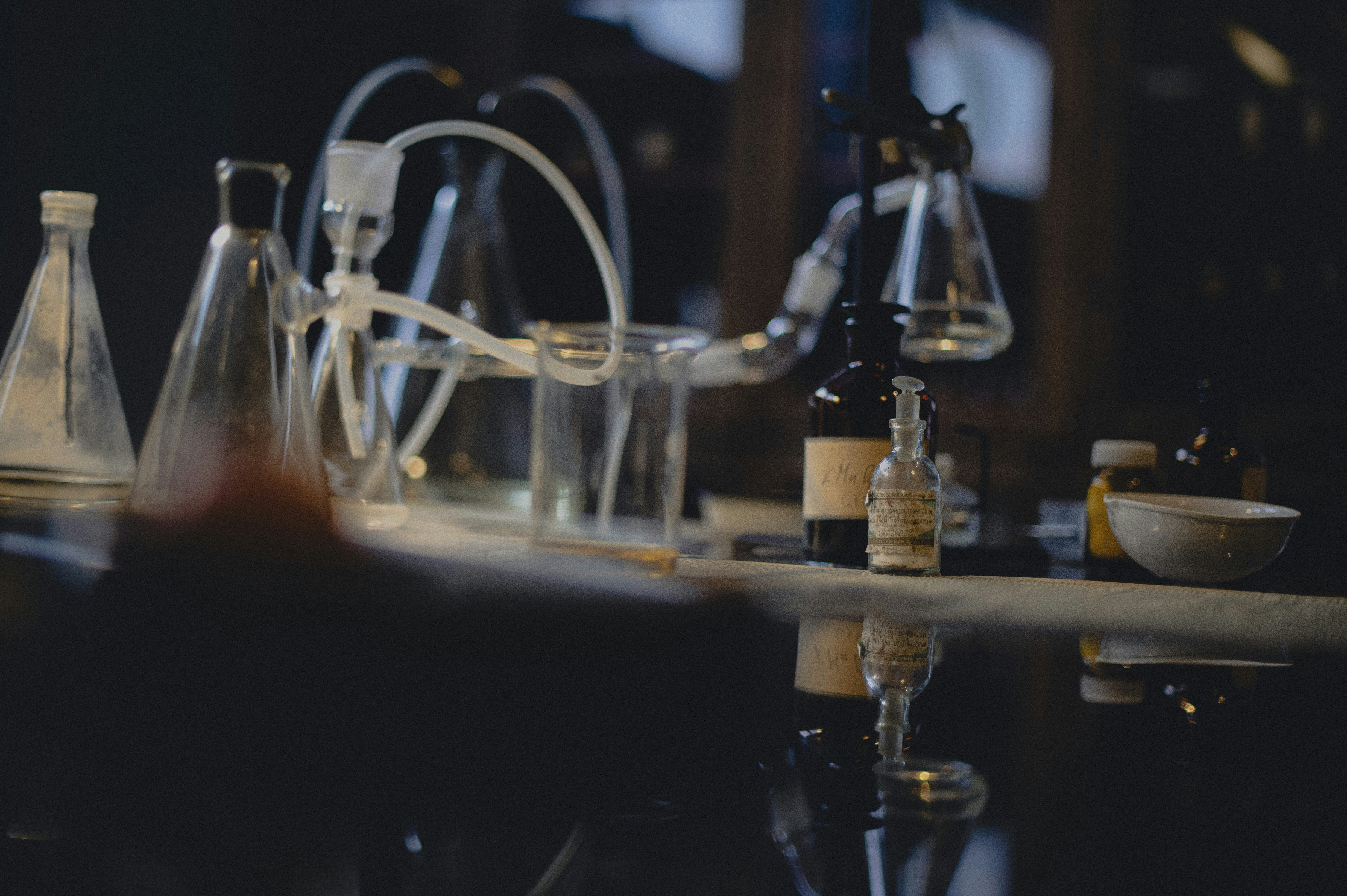 A laboratory setup with various beakers and scientific equipment, representing formulation and research.