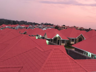 Modern villa with stone coated metal roof tiles installed