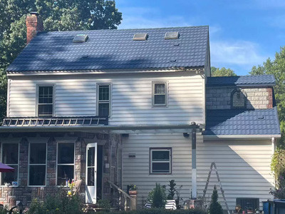 Residential roof renovation with lightweight stone coated tiles