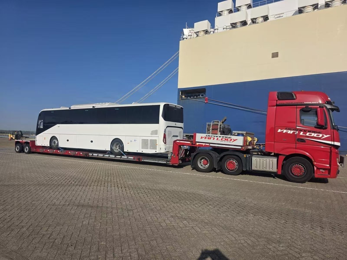 Electric vehicle driving up the ramp of a Ro-Ro ship at Zeebrugge port