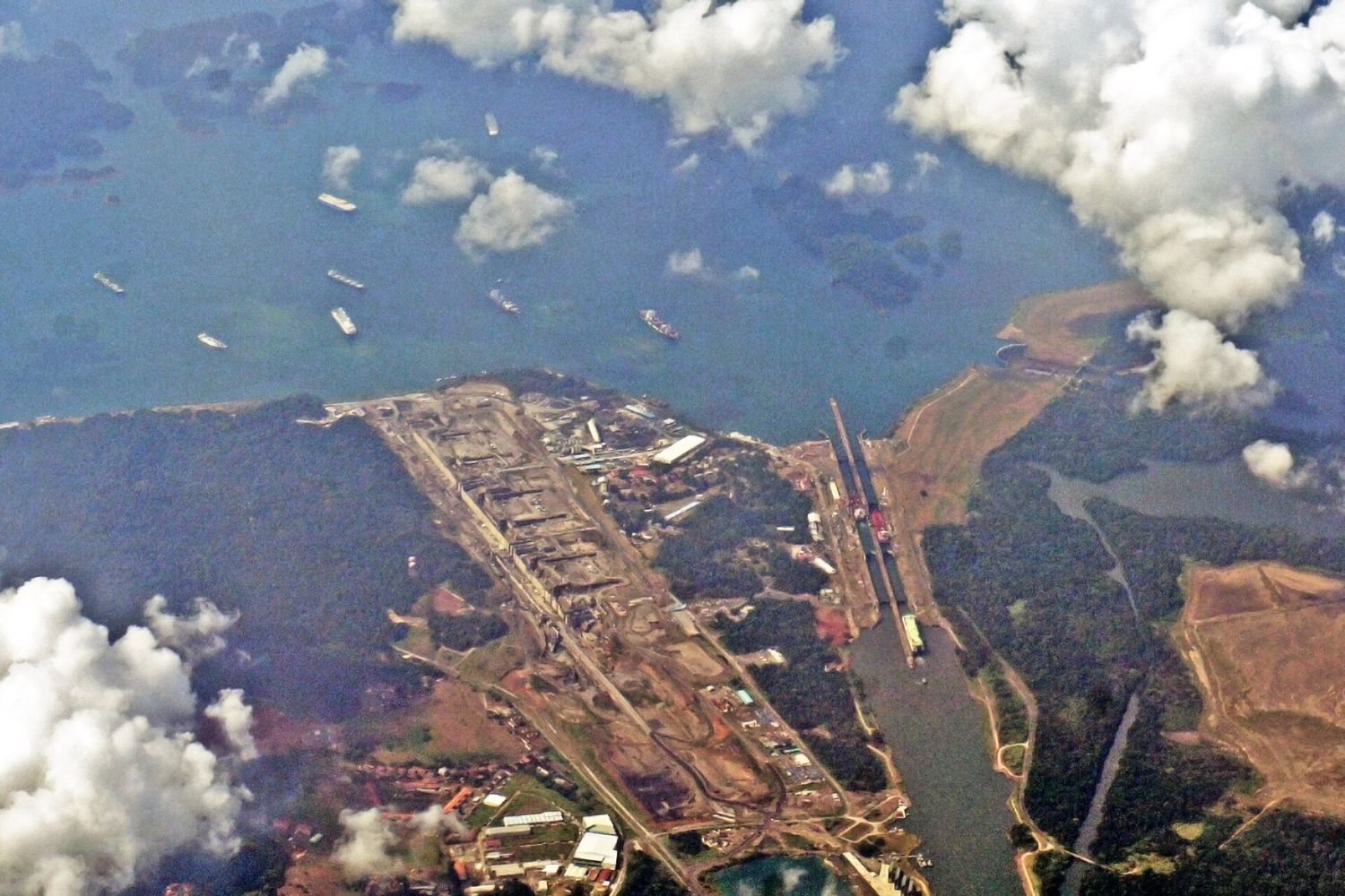 A transiting vessel under tow through the lock chambers of the Panama Canal