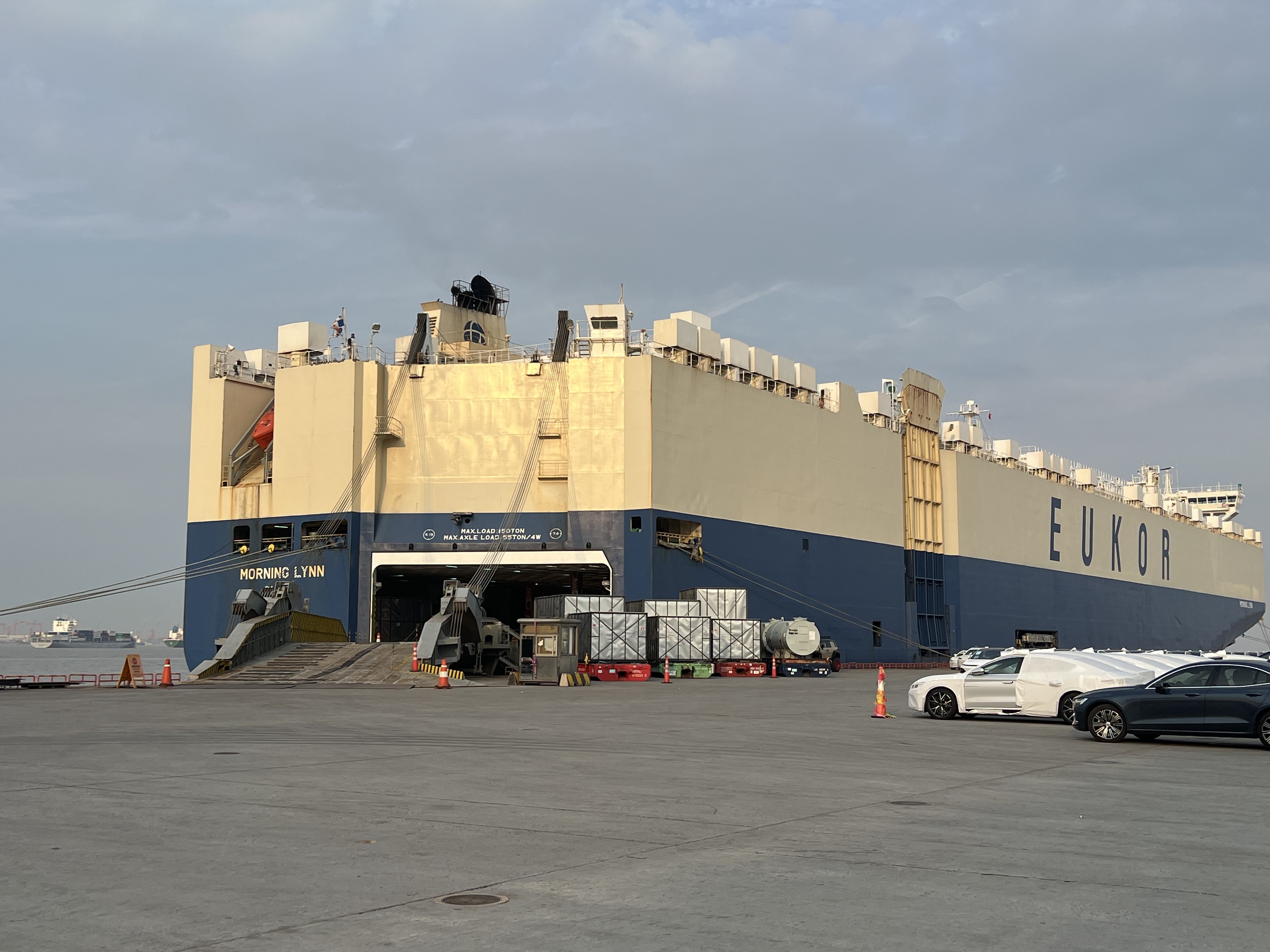 Ro-Ro cargo vessel carrying vehicles docked at a port berth