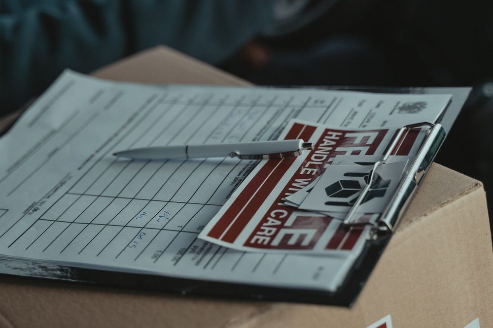 Shipping documents on a clipboard