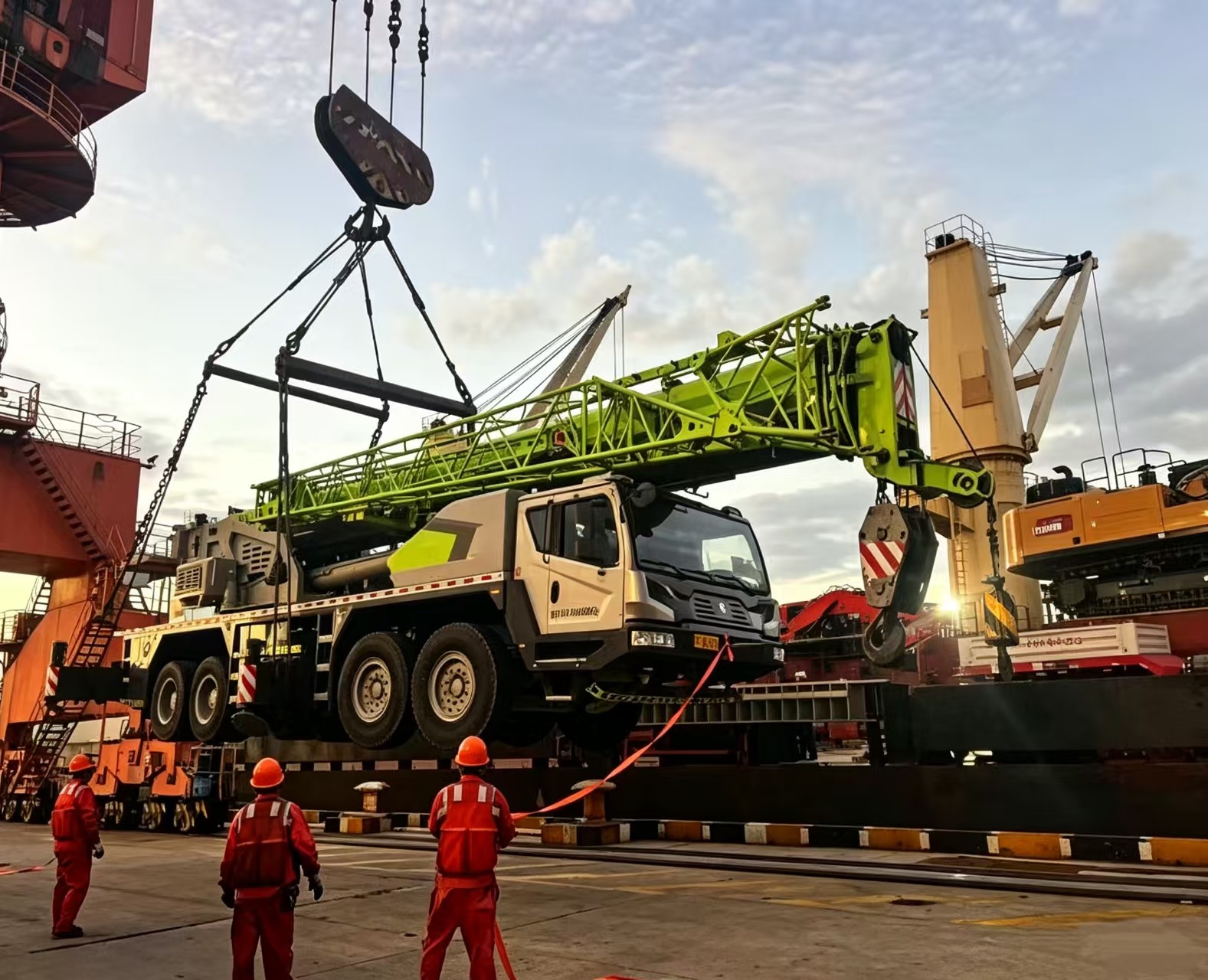 Heavy industrial machinery stored at a dockside facility