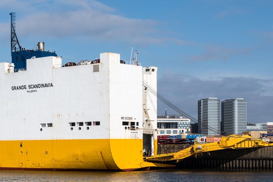 Con-ro vessel docked at a terminal with roll-on roll-off cargo ramps