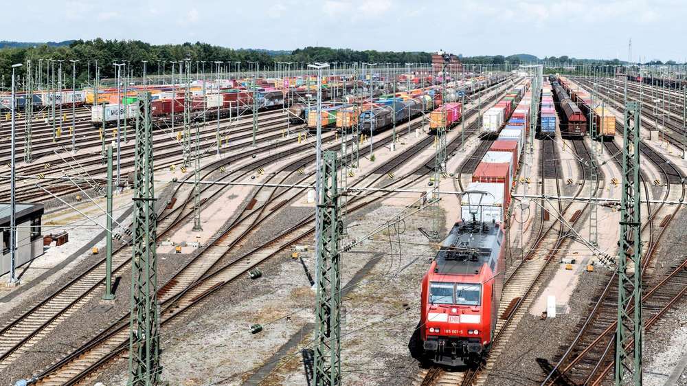 Container train loaded with shipping containers at a rail freight terminal