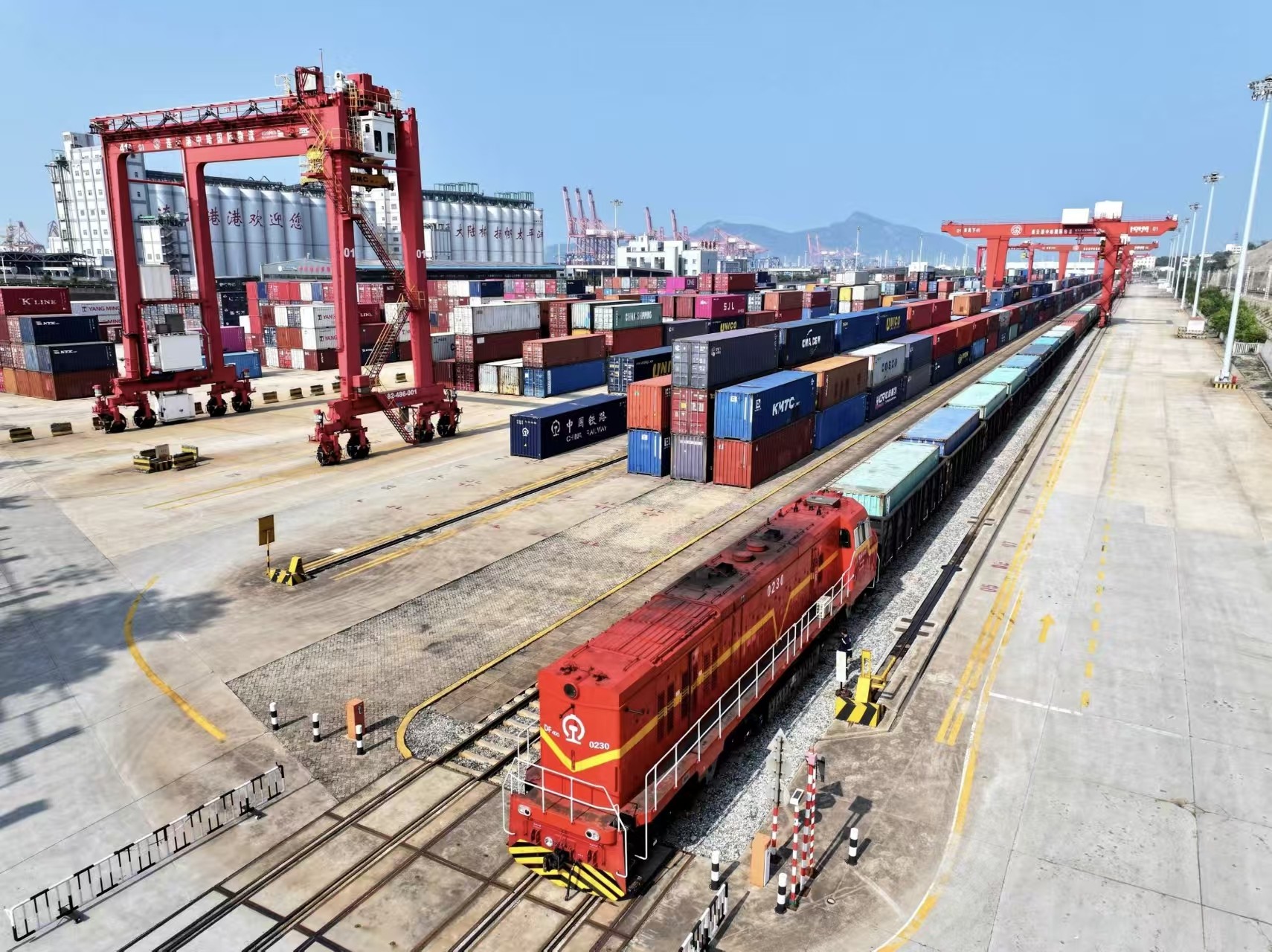 Container train loaded with shipping containers at a rail freight terminal
