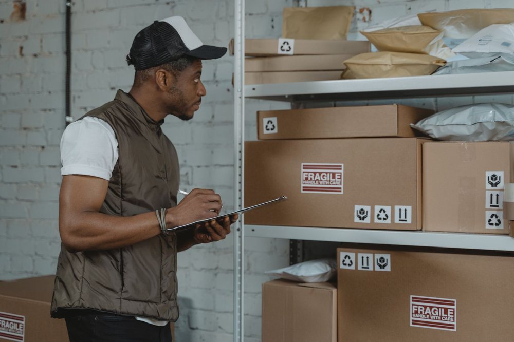 Warehouse staff checking cartons and packaging condition before dispatch