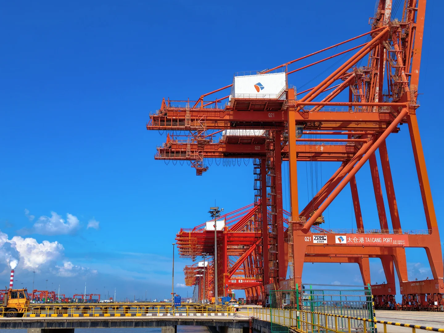 Ship-to-shore gantry cranes working containers at an international terminal