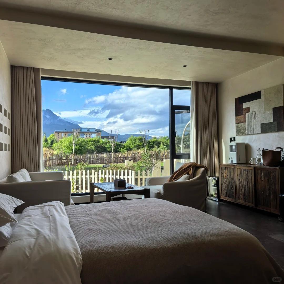 First encounter with Lijiang, check into a traditional Naxi courtyard hotel, evening walk through the ancient town's illuminated streets, and introduction to Dongba culture through traditional Naxi ancient music.