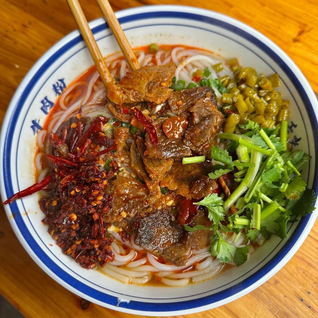 Sleep in and enjoy a leisurely morning. Find an authentic local shop in the ancient town's alleyways for one last bowl of Xiangxi rice noodles, letting your taste buds remember this land's unique flavors. Private car transfer to Tongren Fenghuang Airport or Huaihua South Railway Station, concluding this unforgettable journey through fantastical mountains and cultural border towns.